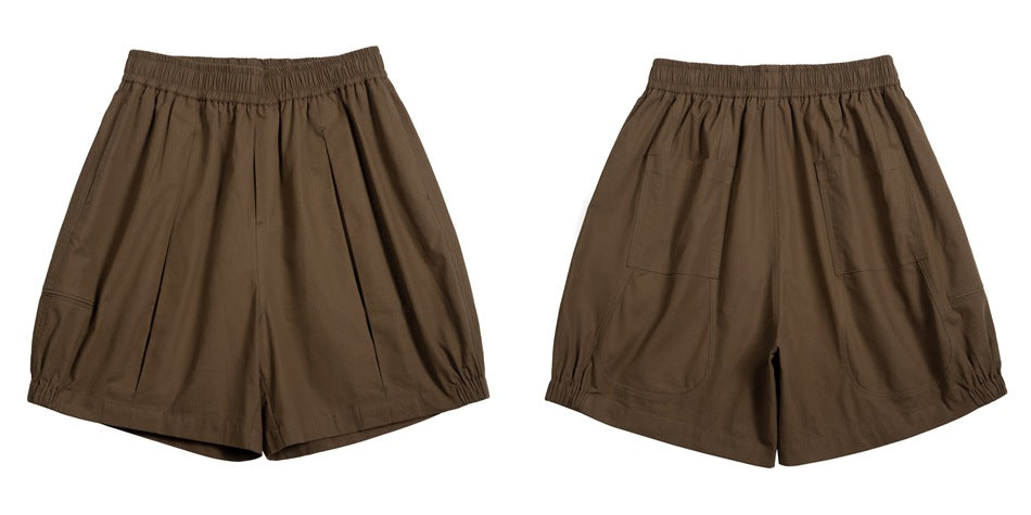 Brown loose shorts shown from front and back, with an elastic waist and two rear patch pockets.