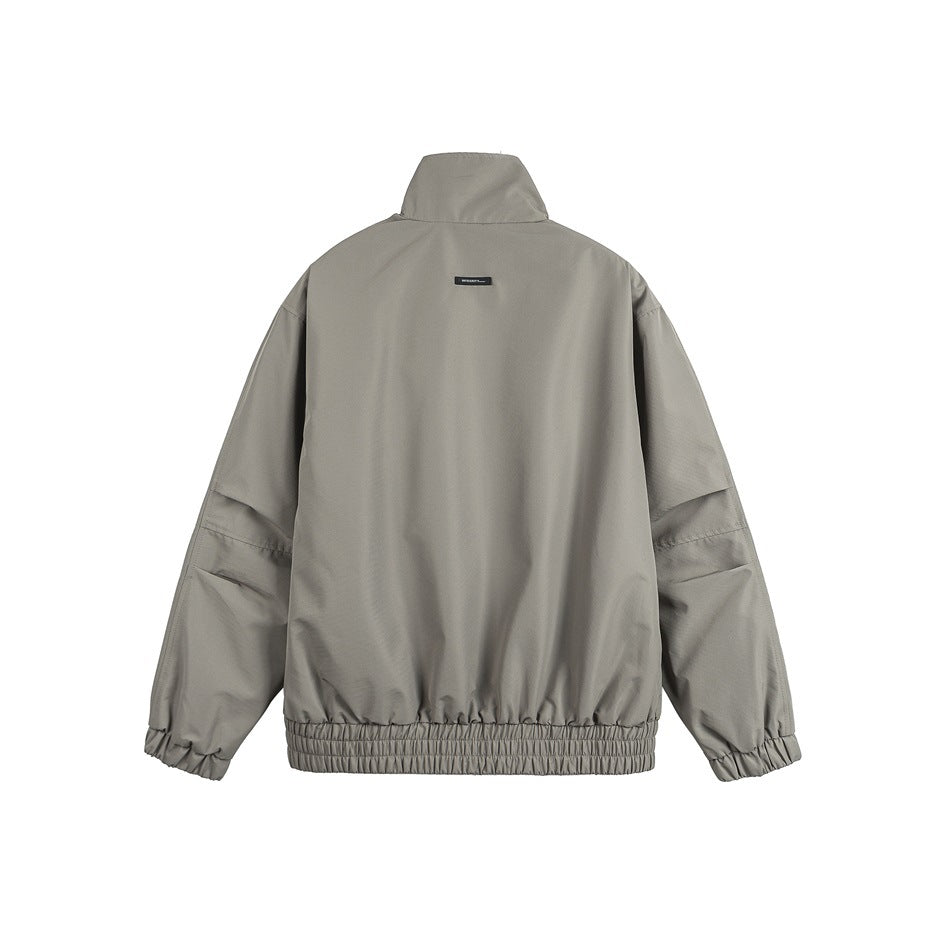 Back view of an olive-gray jacket with a stand collar, long sleeves, elastic cuffs, and a gathered hem.
