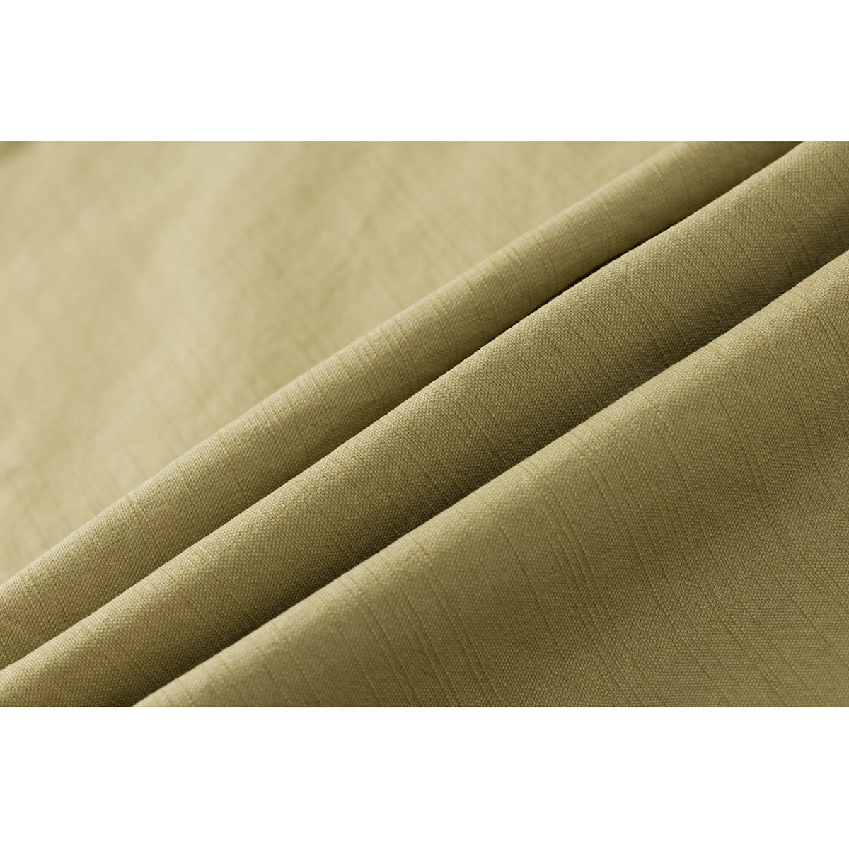 Macro view of olive-khaki fabric draped in folds, showing its fine woven texture.