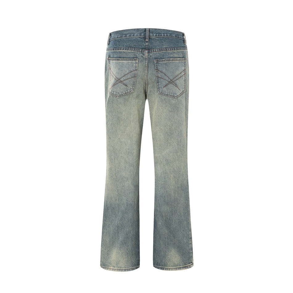 Back view of faded blue wide-leg jeans with two patch pockets and crossed decorative stitching.