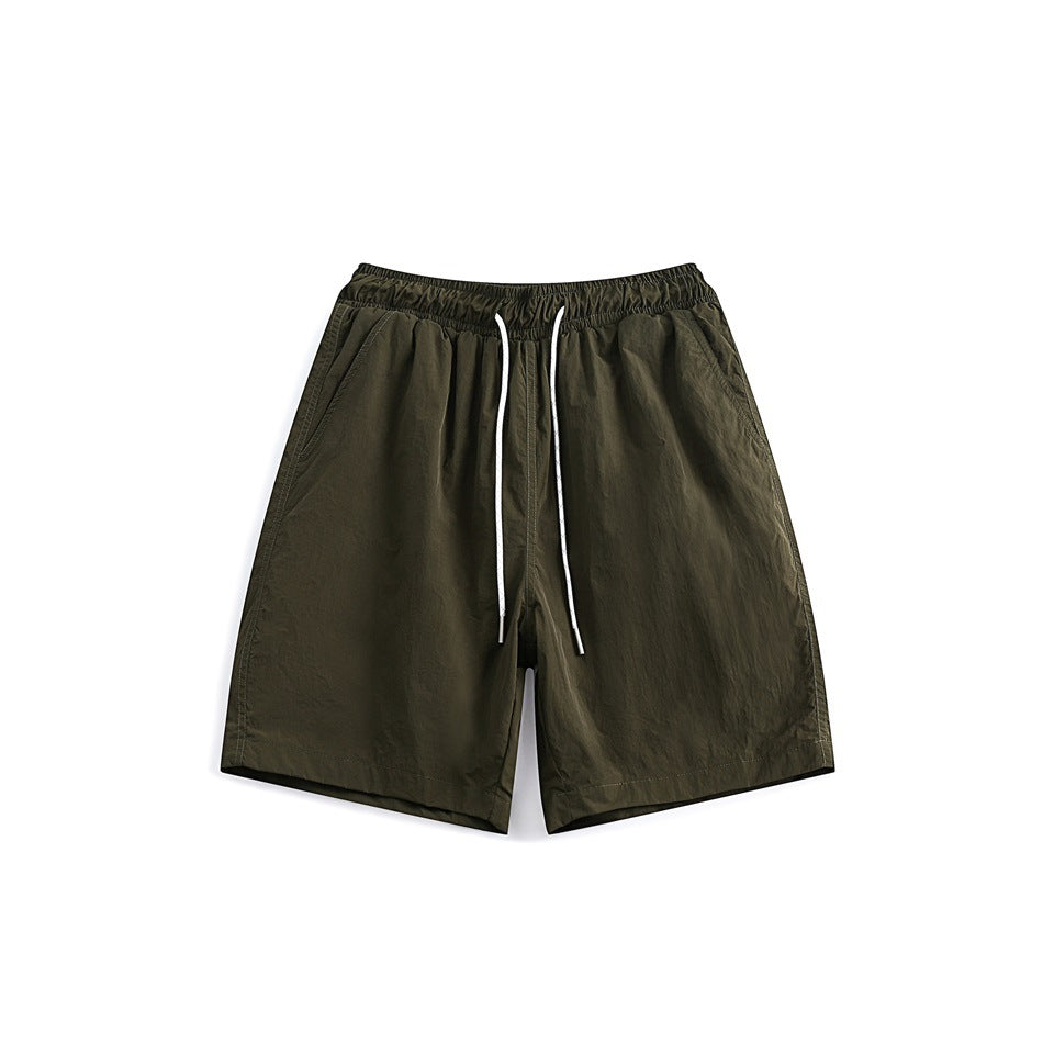 Army green drawstring shorts with elastic waistband and side pockets, front flat view