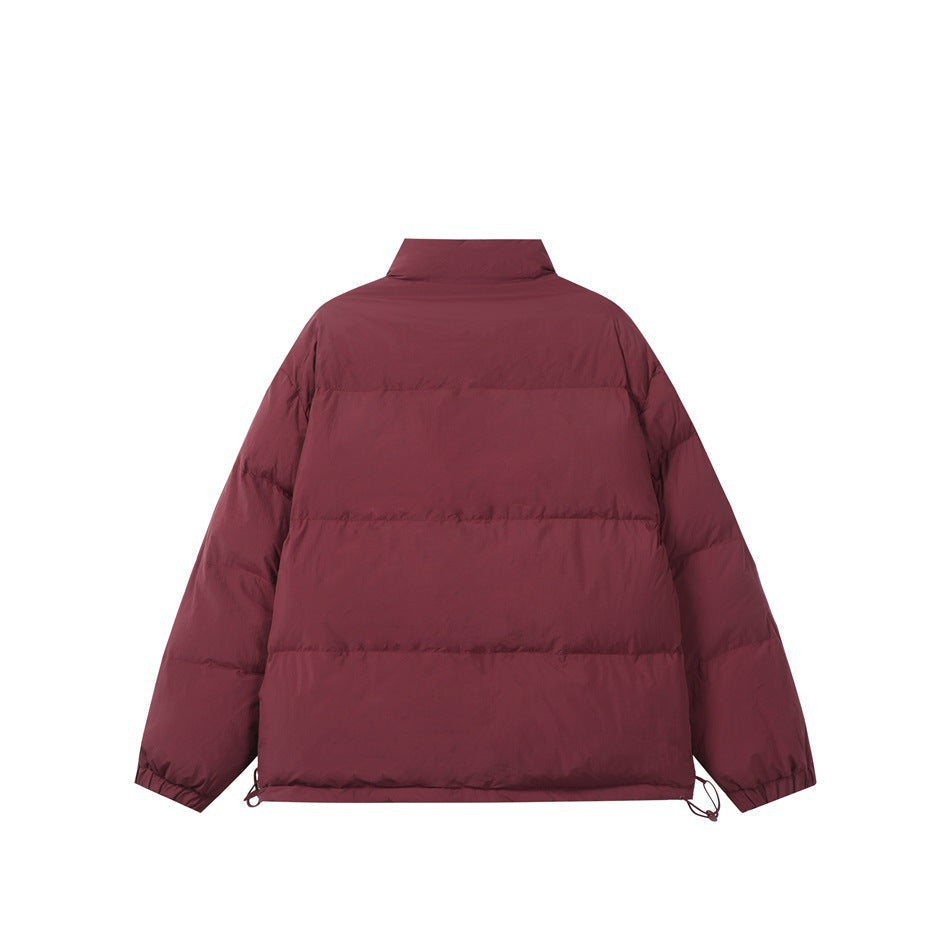 Back view of a burgundy padded jacket with horizontal quilting, a high collar, and hem drawcords.