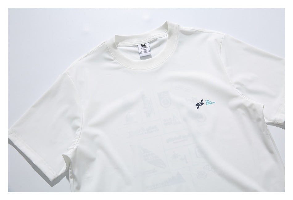 Angled close view of a white crew-neck T-shirt with a small chest emblem and faint graphics across the front.