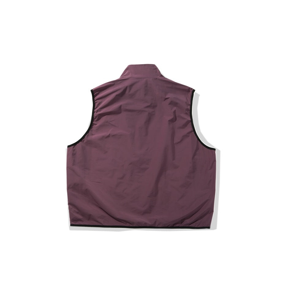 Back view of a plum sleeveless vest with a stand collar and black trim around the armholes and hem.