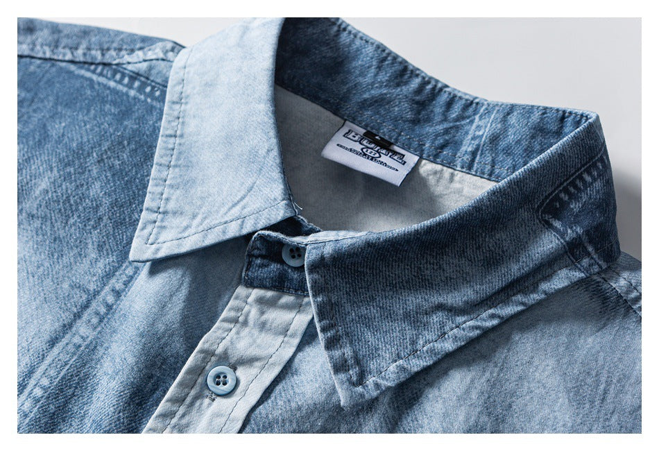 Close-up of a blue washed shirt collar, button placket, and sewn-in neck label.