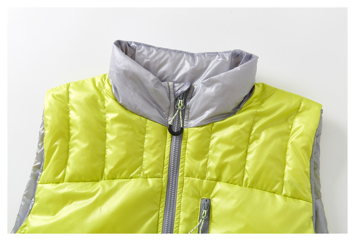 Close-up of the upper front of a lime-yellow quilted vest with a light gray stand collar and central zipper.