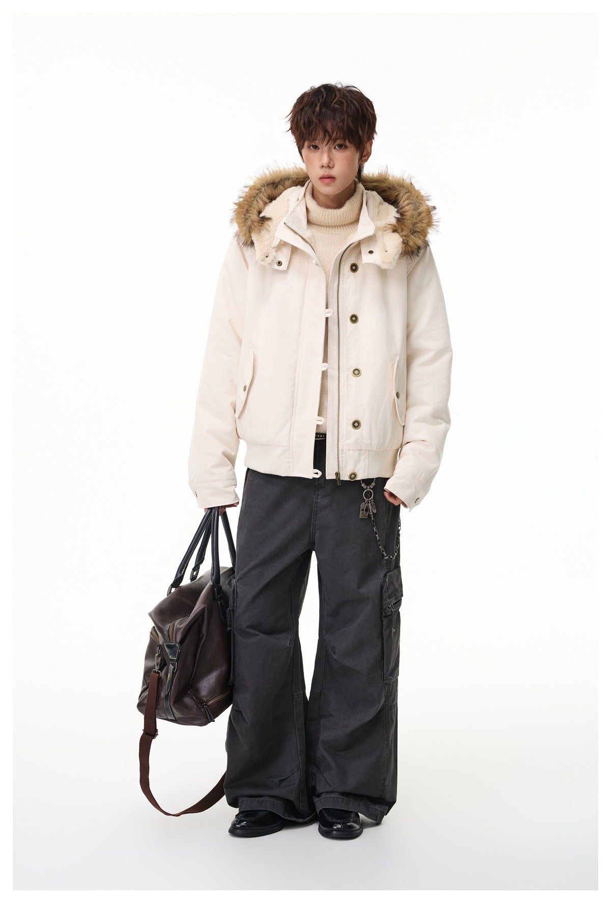 Full-length model wearing an open ivory fur-trimmed hooded jacket with dark wide-leg cargo trousers.