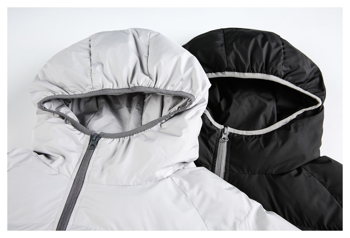 Close view of light gray and black quilted jacket hoods with contrasting trim and front zippers.