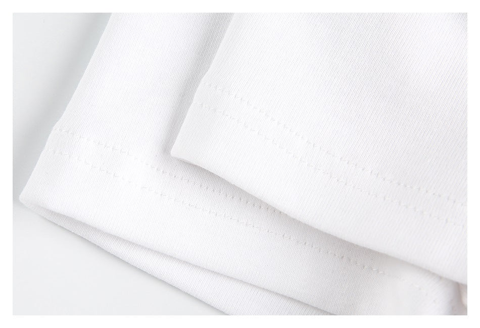 Close-up of a white garment hem with parallel rows of stitching.