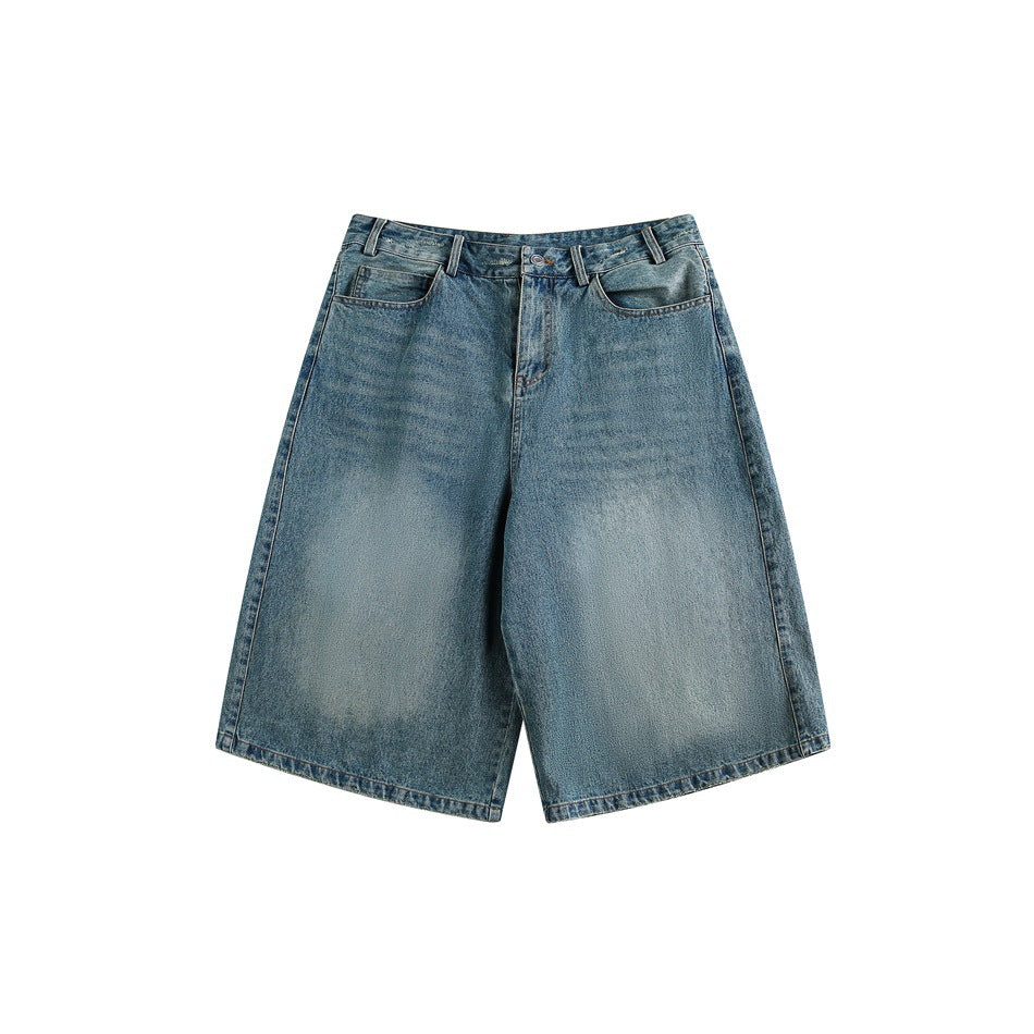 Front view of faded blue wide-leg knee-length denim shorts on a white background