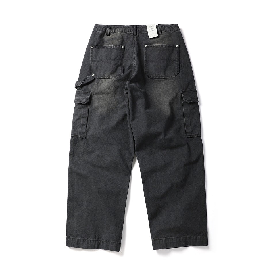 Back flat lay of washed black cargo pants with two patch back pockets, side cargo pockets and a hammer loop