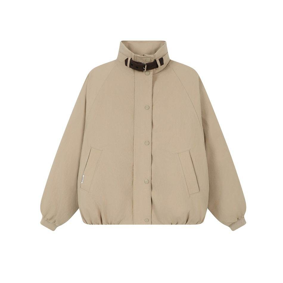 Khaki stand-collar jacket with brown buckled collar strap, snap front, raglan sleeves and front pockets, flat lay