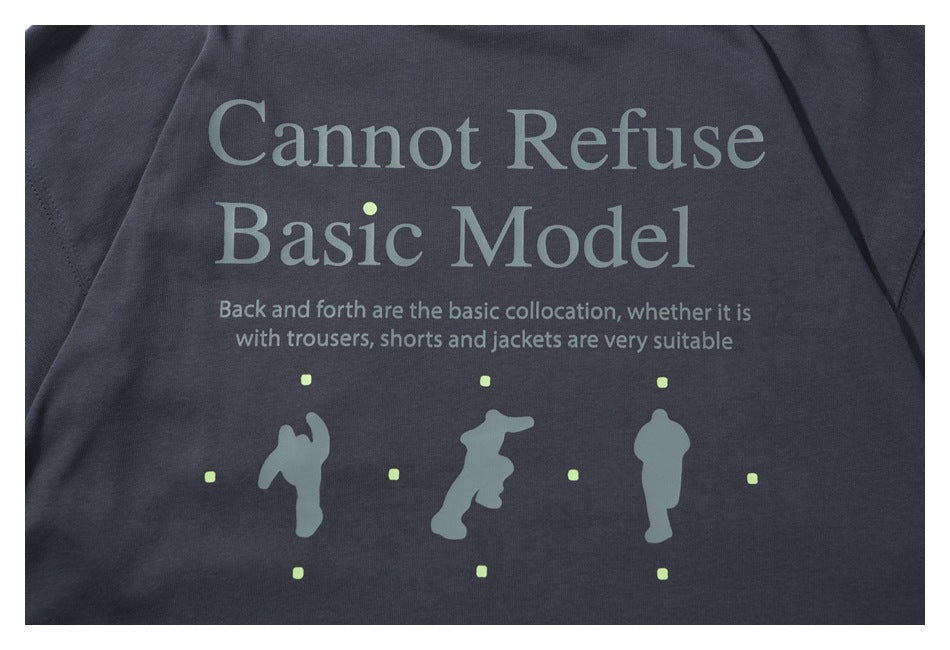 Close-up of a dark charcoal garment printed with English text and small figure graphics.