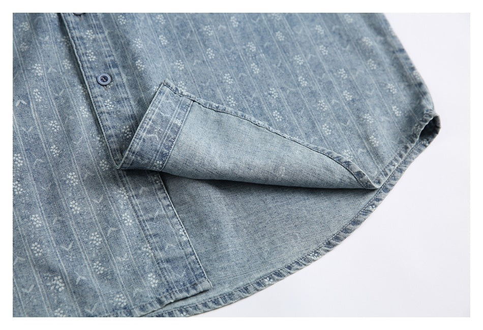 Close-up of the blue patterned shirt with a sleeve cuff folded back to show the reverse.