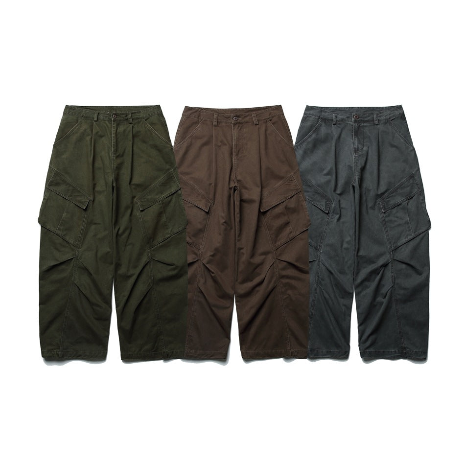 Three pairs of wide-leg cargo pants shown from the front in olive green, brown, and charcoal gray.
