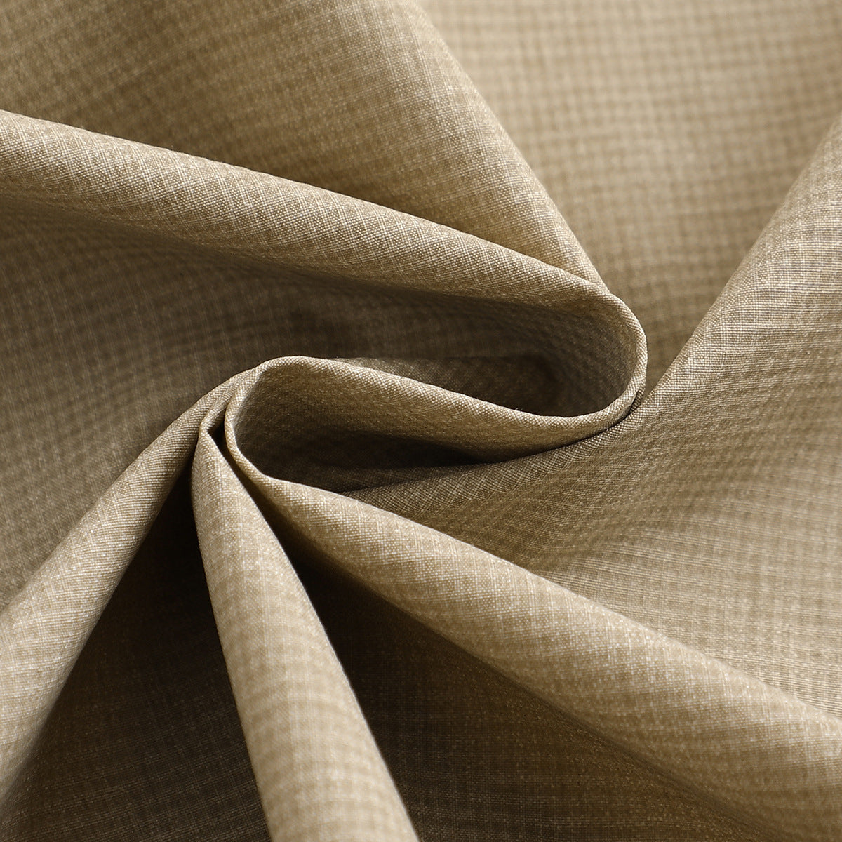 Close-up of beige micro-check fabric folded to show its subtle woven pattern.