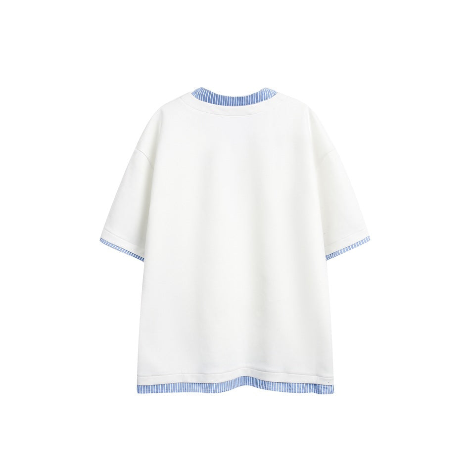 Back view of a white oversized short-sleeve top with blue striped trim at the collar, cuffs, and hem.