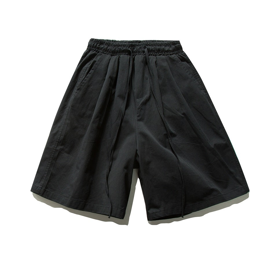 Black wide-leg knee-length shorts with elastic drawstring waist, flat lay front view