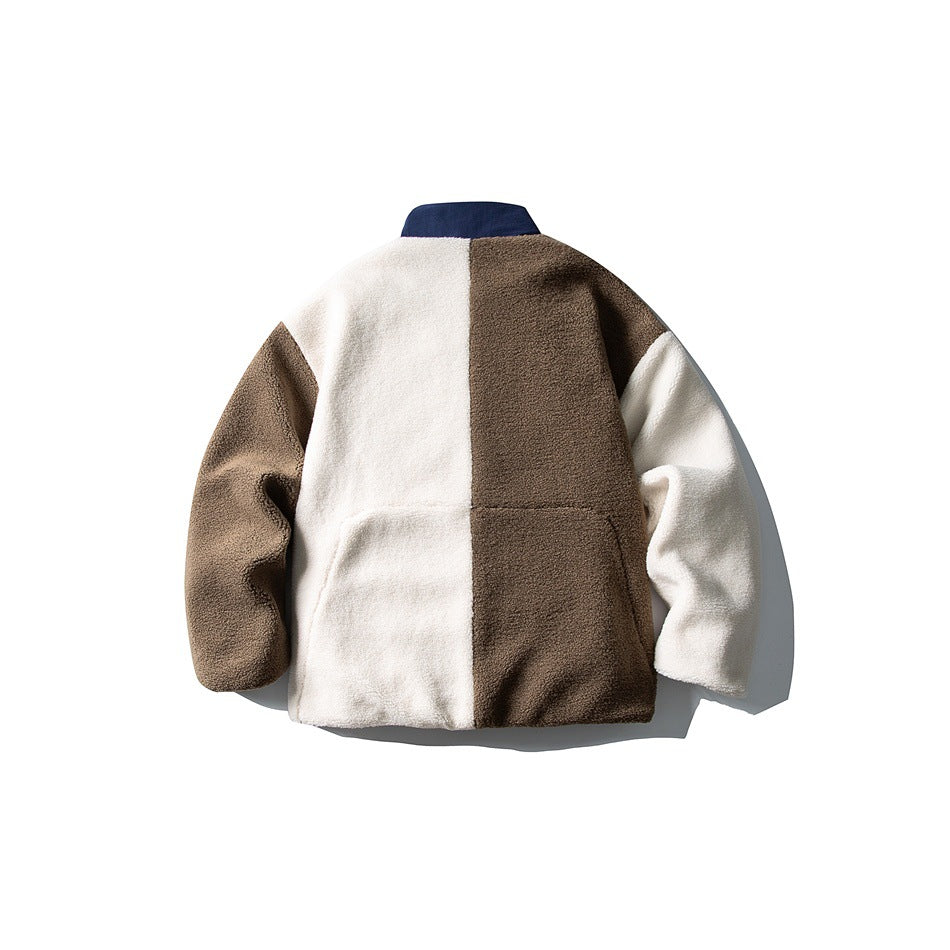 Back view of a flat-laid jacket with cream and brown color-block panels, matching sleeves, and a navy collar.