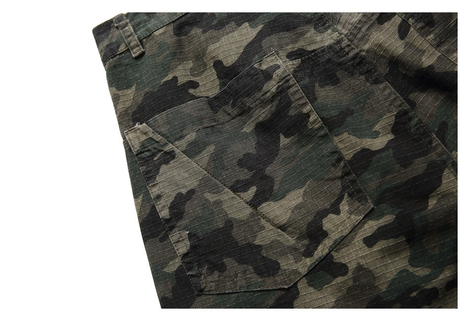 Close-up of a camouflage cargo pocket and stitching on the garment.