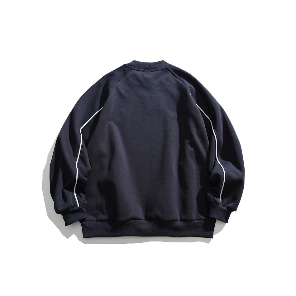 Back view of a dark navy sweatshirt with white piping along the raglan sleeves and ribbed cuffs and hem.