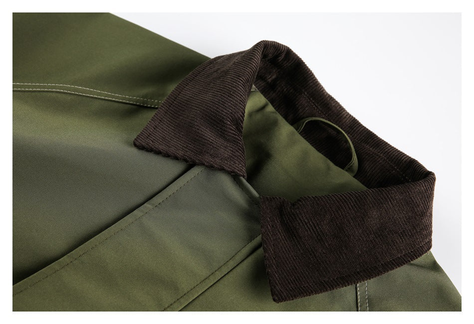 Close-up of an olive jacket with a wide dark brown ribbed collar and visible contrast stitching.