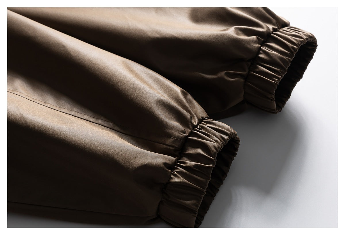 Close-up of the brown jacket's sleeves and gathered elastic cuffs.