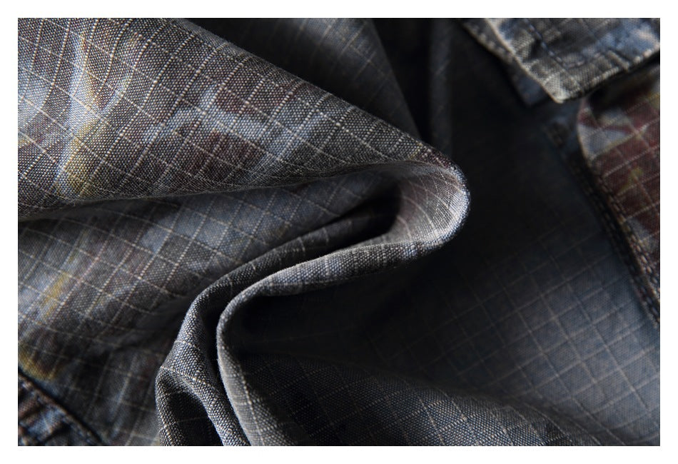 Close-up of the gray plaid fabric, showing its fine grid pattern and folded drape.