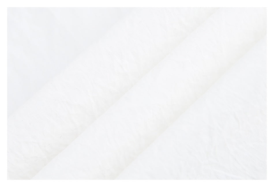 Close-up showing the subtle texture and folds of white fabric.