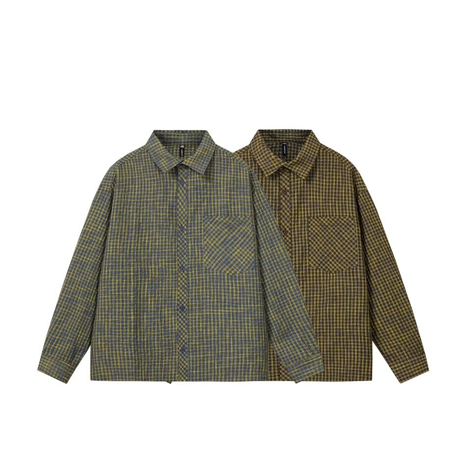 Two long-sleeve plaid button-up shirts shown from the front, one blue-gray with mustard checks and one brown with checks.