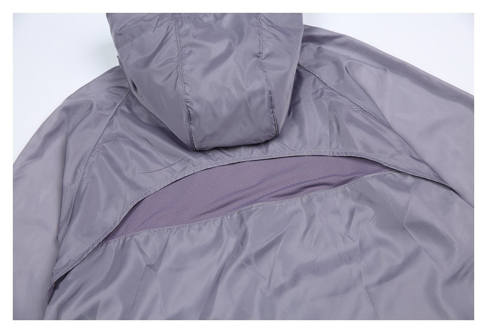 Back view detail of a gray-purple jacket showing a mesh ventilation panel beneath the upper yoke.