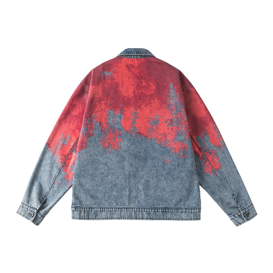 Back view of a red and blue distressed denim jacket with long sleeves, a blue collar and a straight hem.