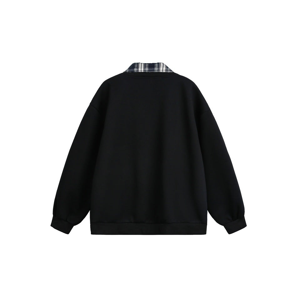 Back view of a black snap-front jacket with a black-and-white plaid collar.