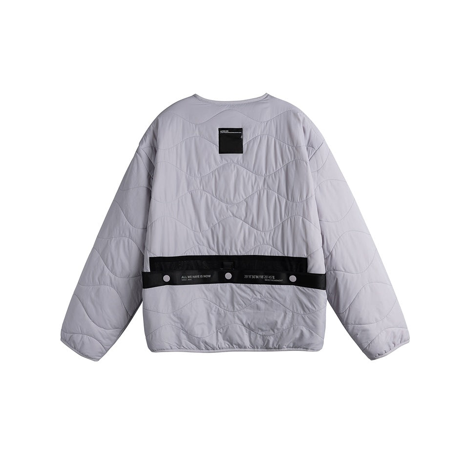 Back view of a light gray quilted jacket with wavy stitching, long sleeves and a black snap-fastened waist strap.