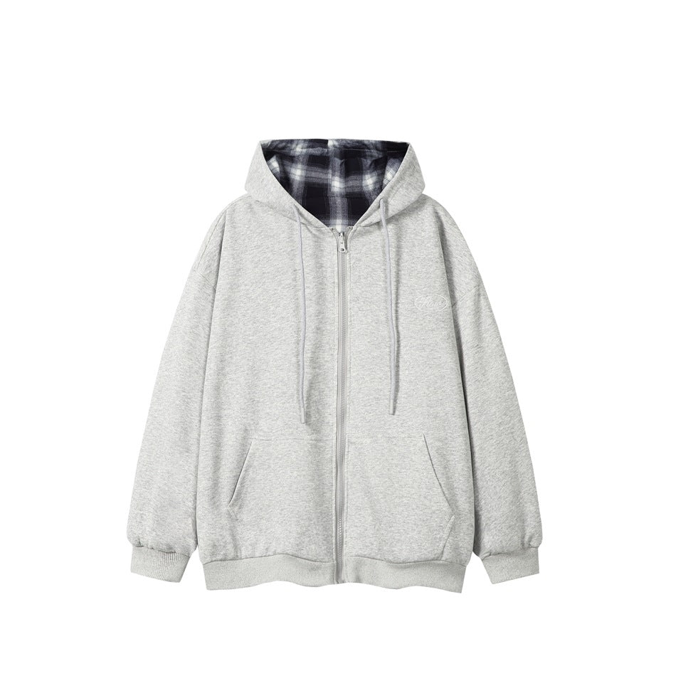 Gray zip-up hooded sweatshirt flat lay with navy and white plaid hood lining, drawstrings and front pockets