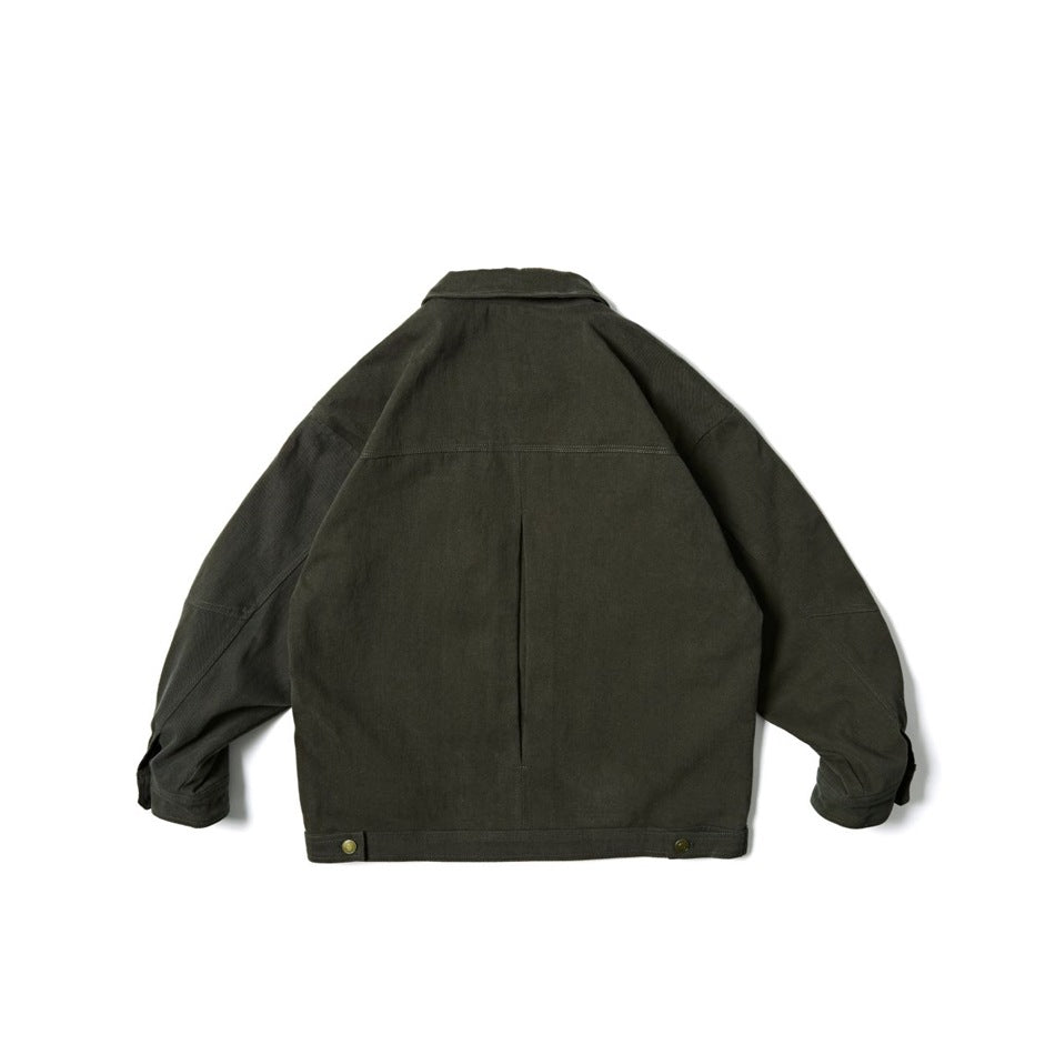 Back view of dark olive green jacket showing yoke seam, center back pleat and button tabs at the hem