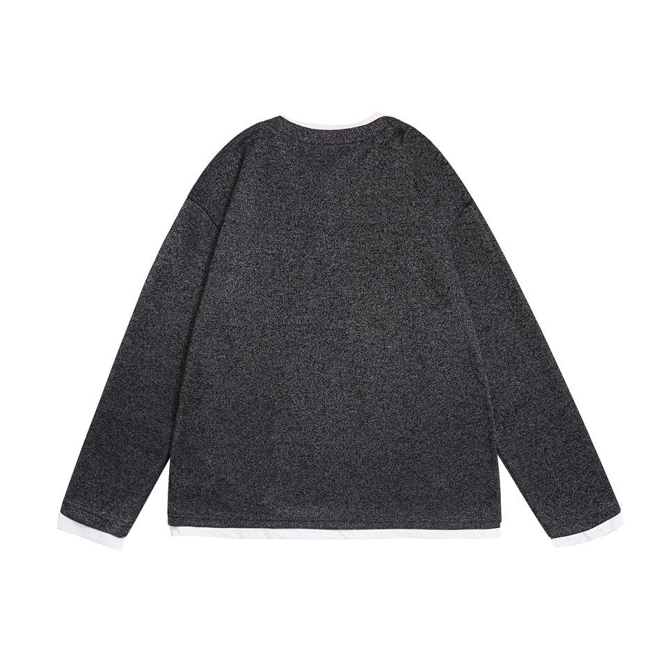 Back view of a dark charcoal heather long-sleeve top with white trim at the neckline, cuffs, and hem.