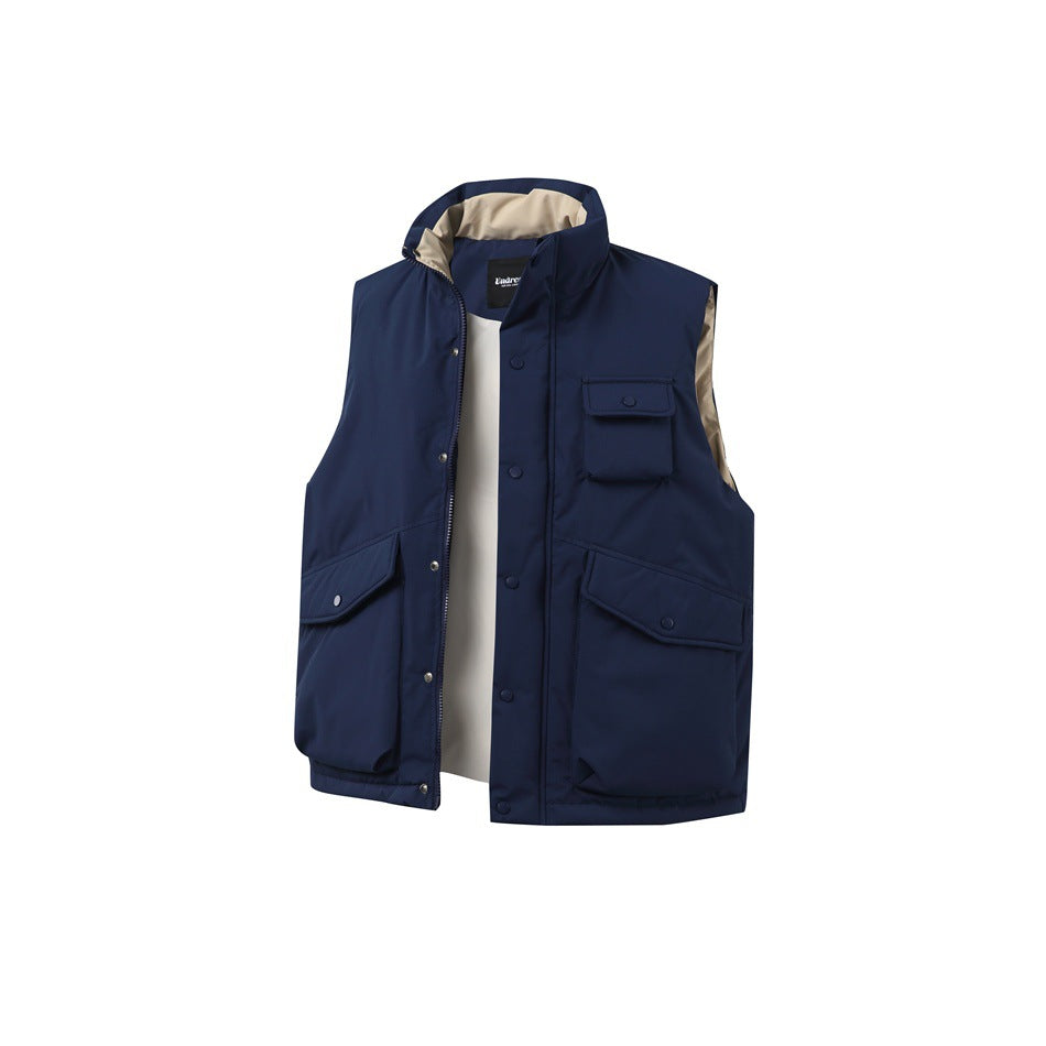 Navy blue padded vest with unzipped front, snap placket, three flap pockets and tan lining at the collar