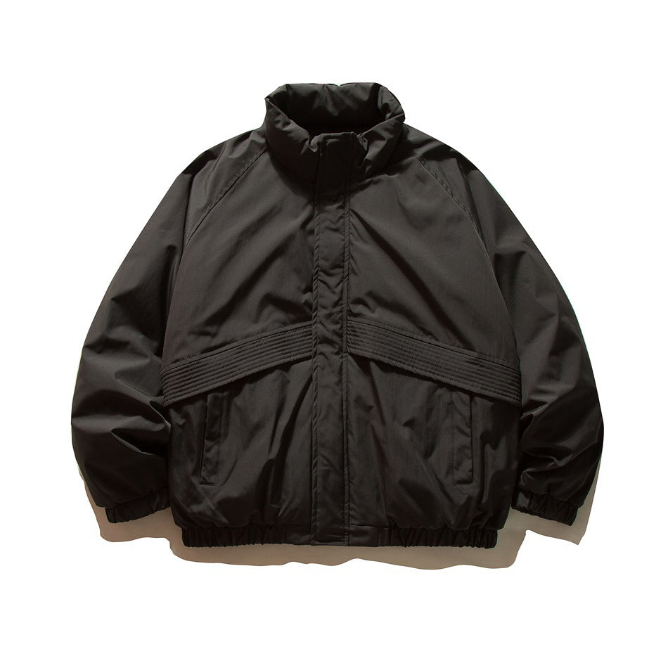 Black padded stand-collar jacket, front view, with chevron quilted panel, slanted pockets and elastic cuffs and hem