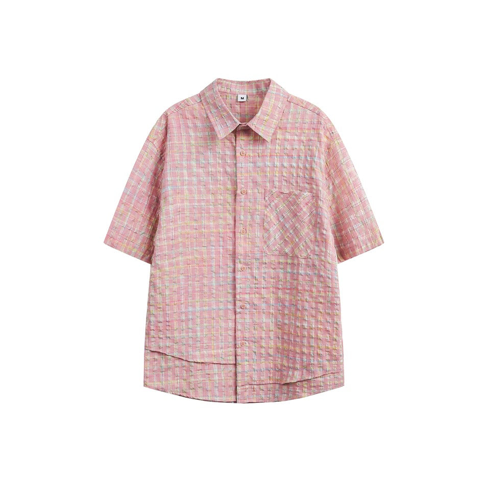 Pink multicolor check short-sleeve button-up shirt with chest pocket and layered hem, flat lay on white