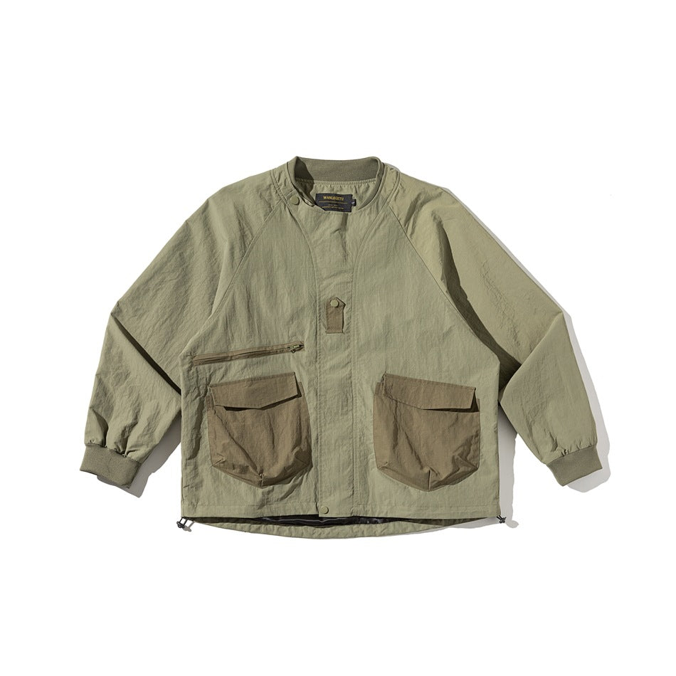 Olive green utility jacket flat lay, front view, with ribbed collar, large flap pockets and drawcord hem