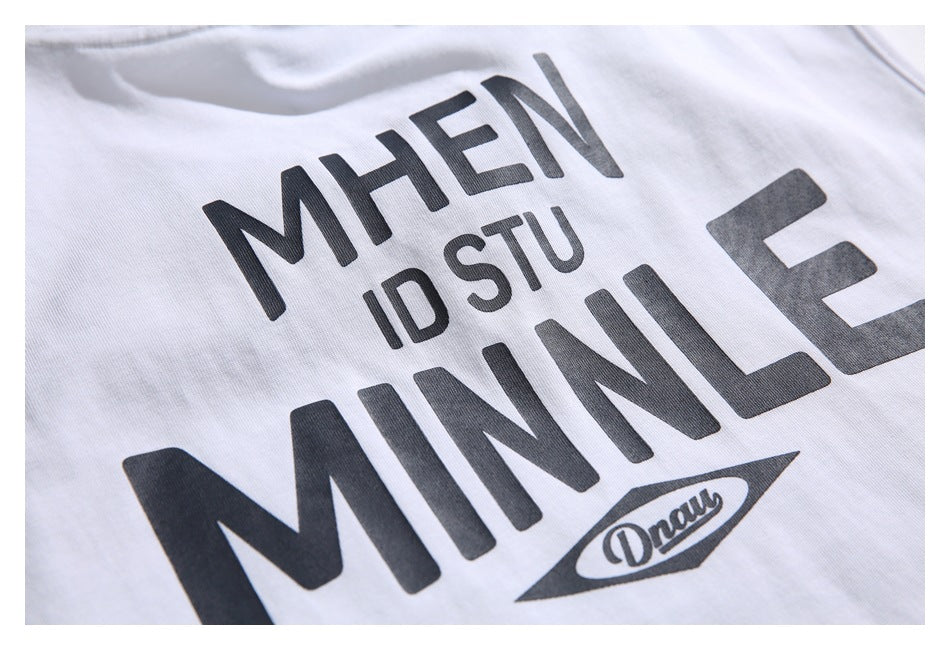 Close-up of the dark graphic printed on the white sleeveless shirt.