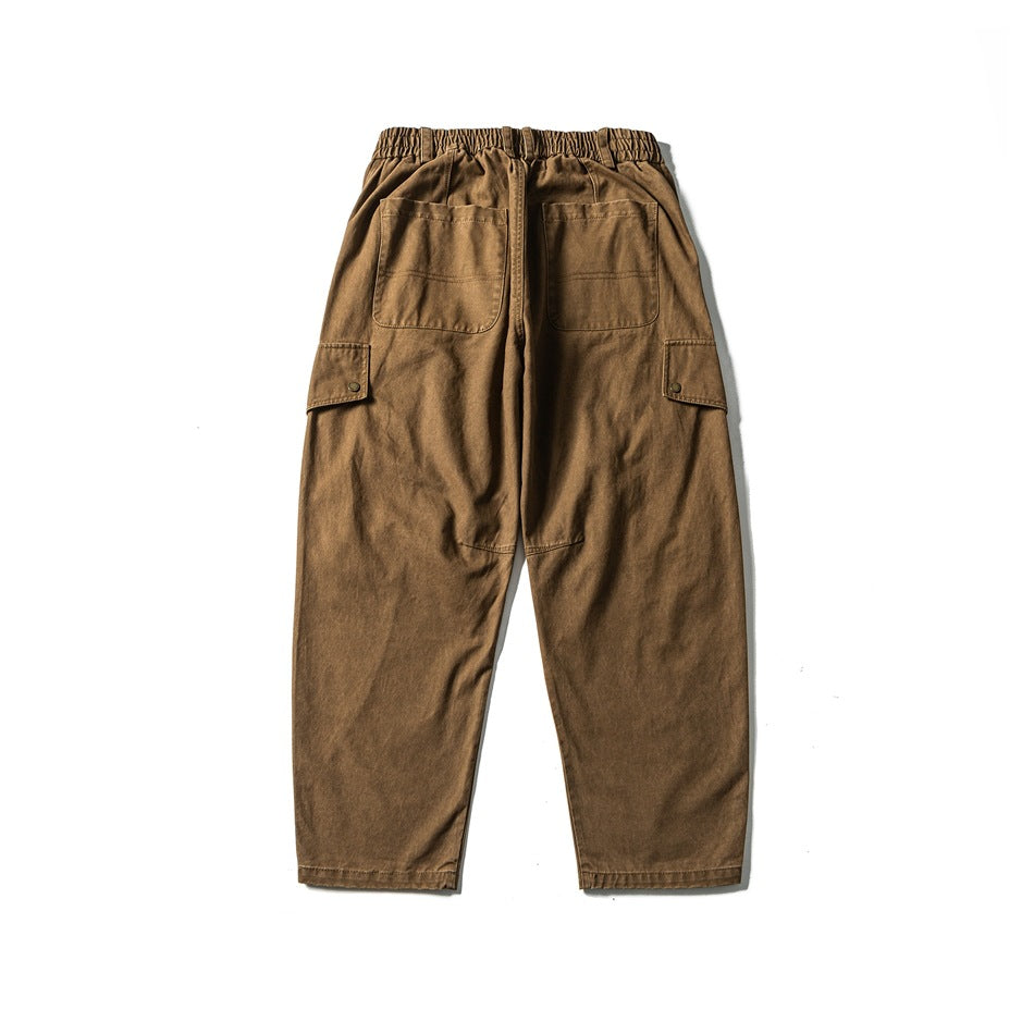 Washed brown wide-leg cargo pants flat lay, back view, elastic waist, two back patch pockets and side flap pockets