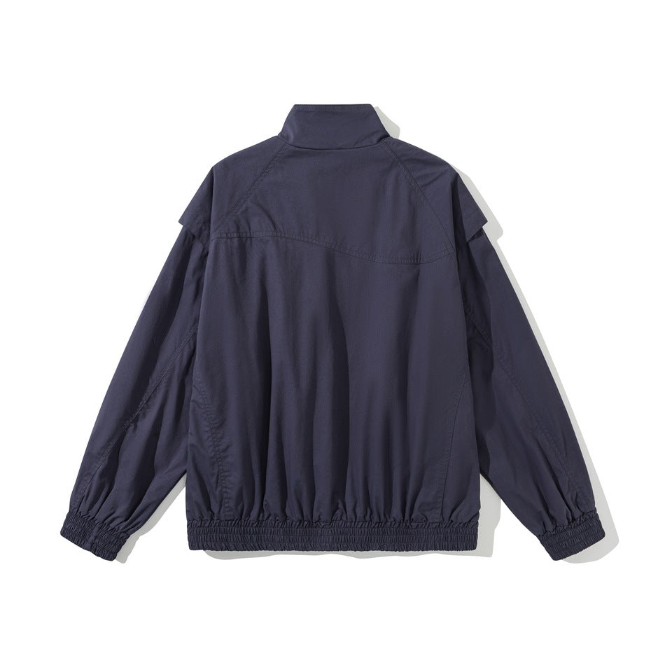 Back view of a navy stand-collar jacket with long sleeves and gathered elastic cuffs and hem.