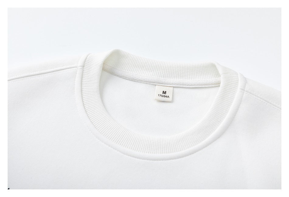 Close-up of a white sweatshirt neckline and inner label marked M and 170/84A.