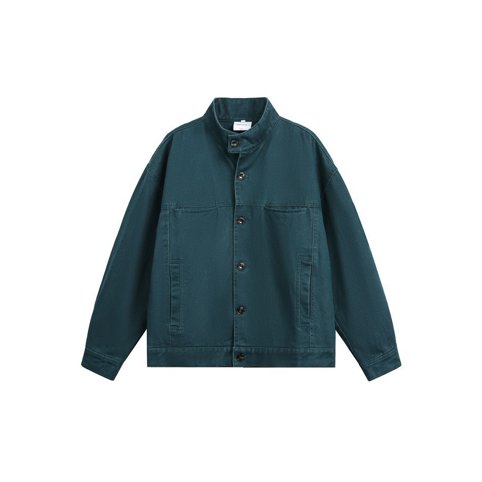 Dark teal button-front jacket with stand collar, chest pockets and side pockets, flat front view on white