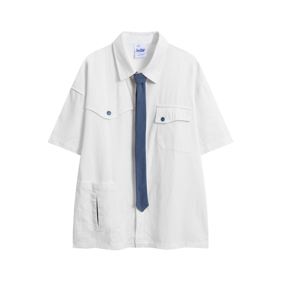 White short-sleeve collared shirt with chest flap pockets, large lower pocket and blue necktie, flat front view
