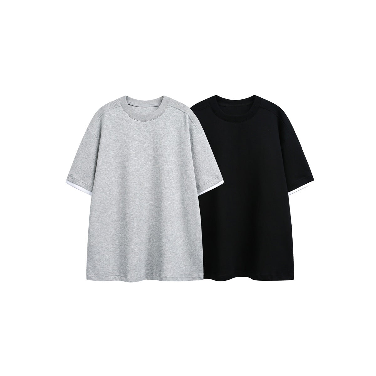 Two oversized crew-neck T-shirts shown together: one light gray and one black, both with white sleeve layers.