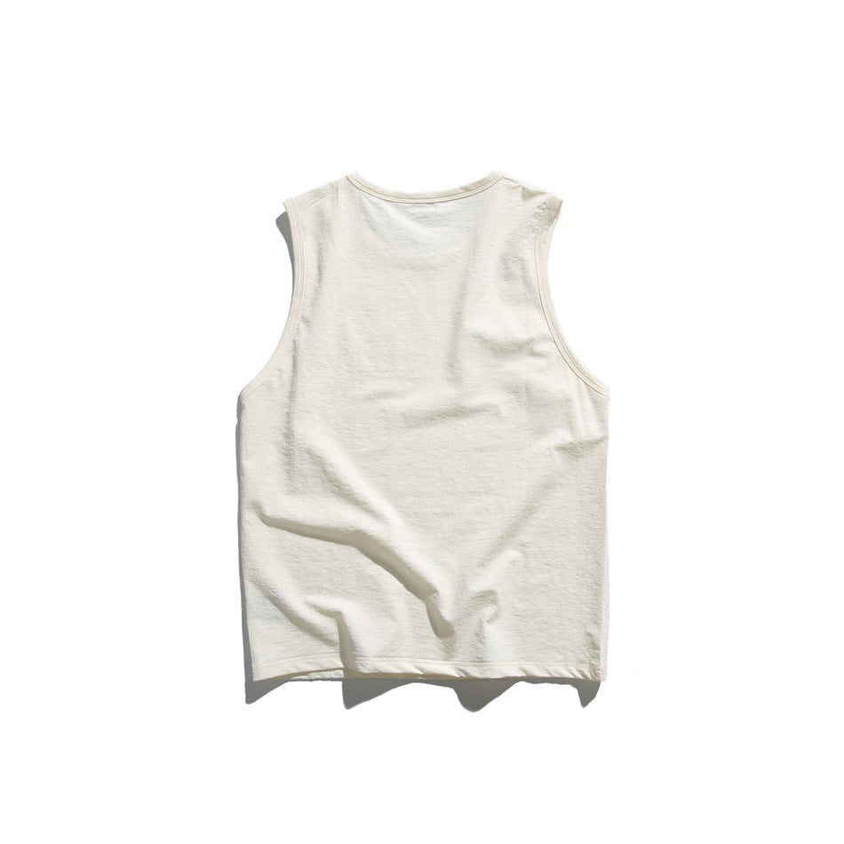 Back view of a plain cream sleeveless tank top laid flat.