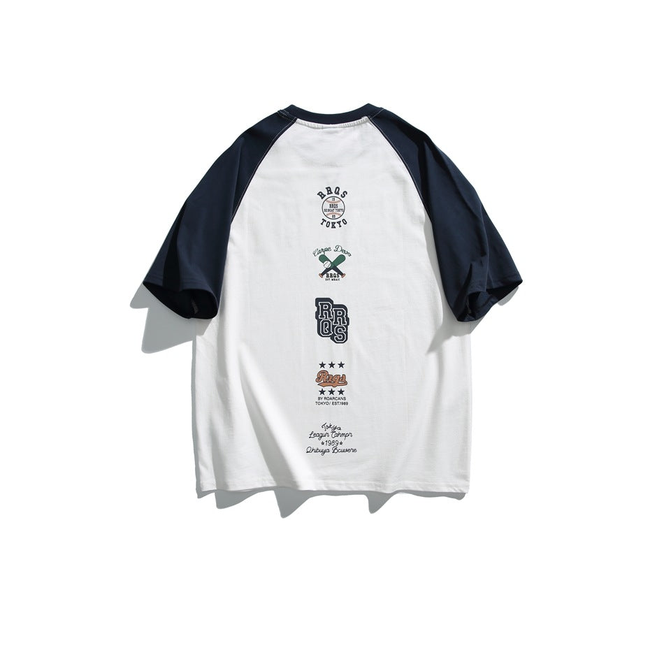 Back view of a white raglan T-shirt with navy sleeves and several vertically arranged graphic prints.
